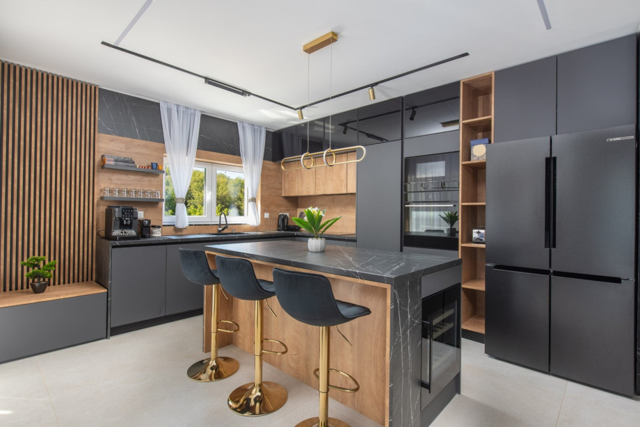 Kitchen featuring a dishwasher, fridge, microwave, espresso coffee maker, and Nespresso machine.