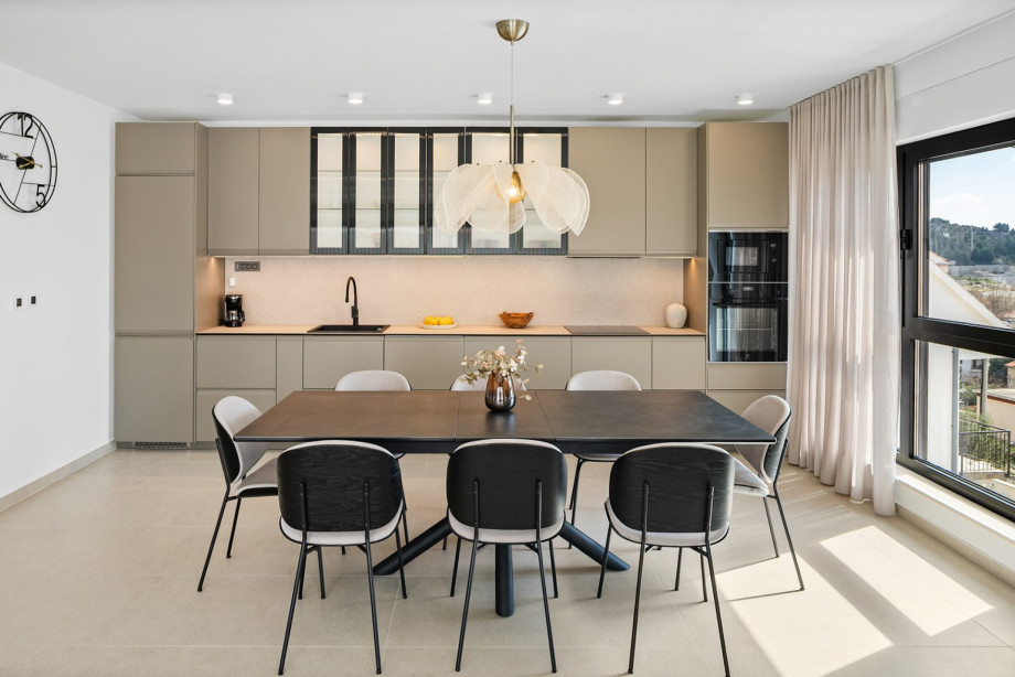 The fully equipped kitchen features a modern design.