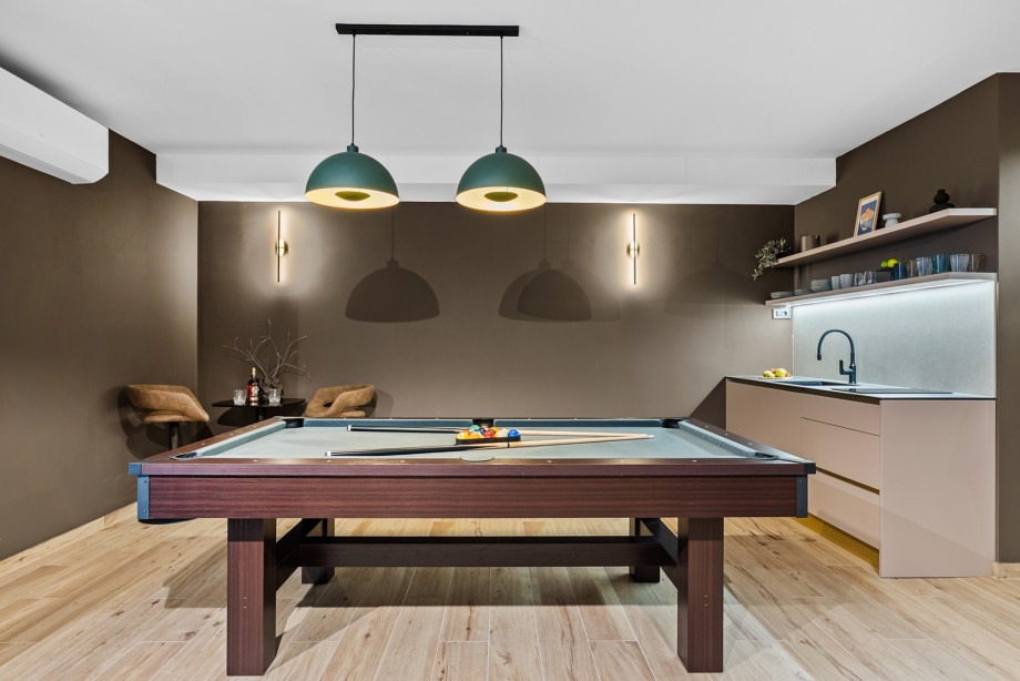 A stylish billiards table is the center of the villa's impressive 55sqm media room.