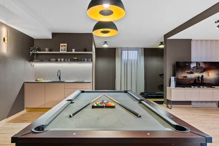 This entertainment hub is equipped with a PlayStation 5 and a surround sound system.