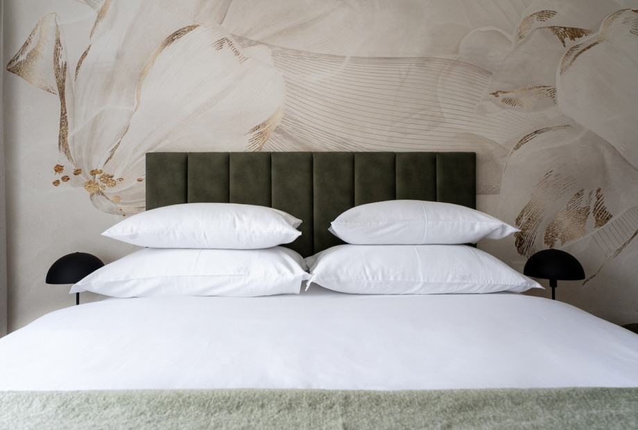 This stylish bedroom offers a queen-sized bed and a TV for your relaxation.