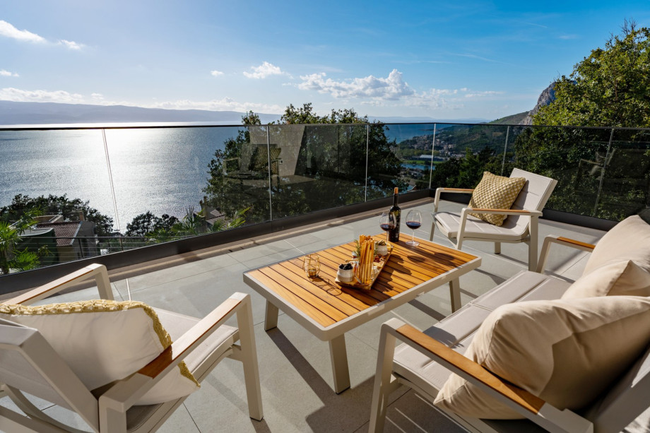 West terrace is a half covered relaxing zone with a lounge corner and outdoor furniture for enjoying a sea views