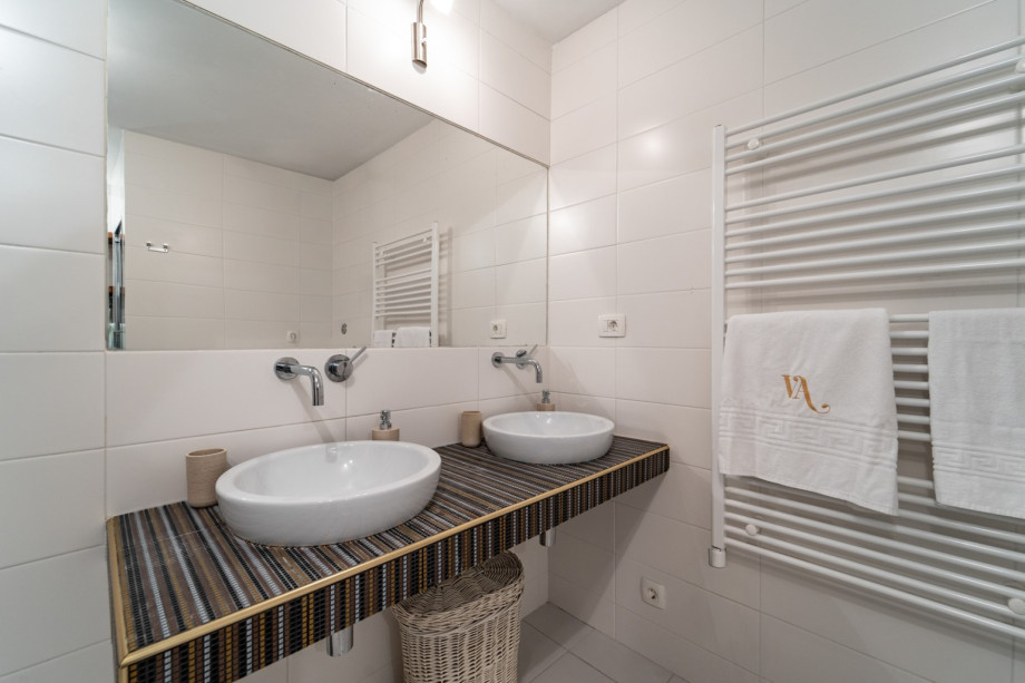 Family bathroom with a shower and washing machine