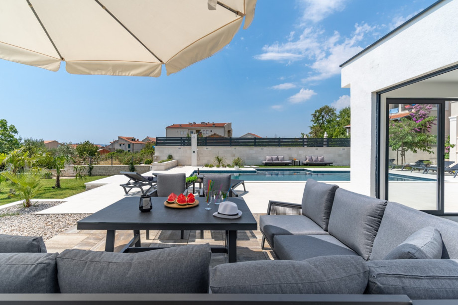 The outdoor area offers a private, heated swimming pool with a no-Chlorine system, with hydro-massage