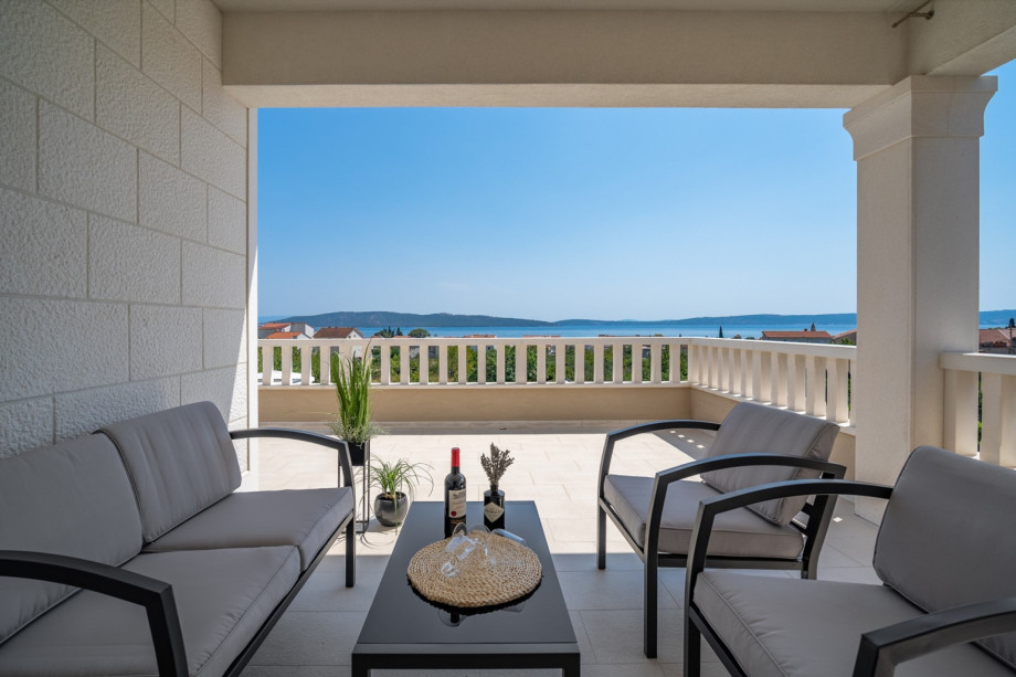 The living room and the gym have an exit to a terrace with sea and pool views