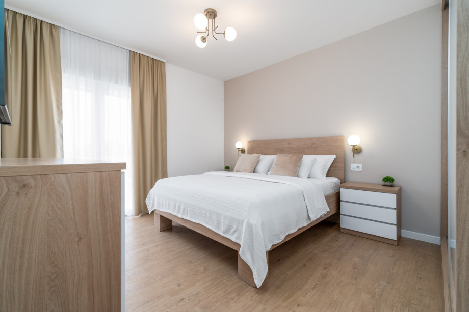 A Bedroom No3 (16sqm) with a king size bed 180cm x 200cm, A/C, TV, and views of nature.