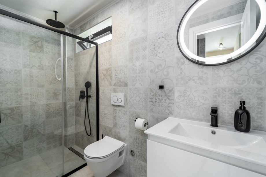 On the ground floor is a family bathroom with a shower