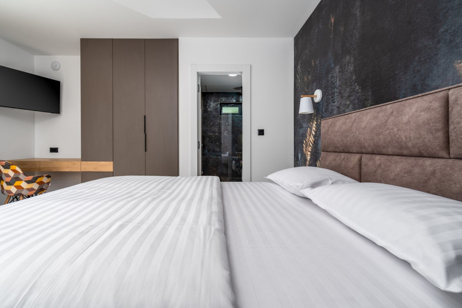 Detached, but also on the ground floor is a Bedroom No1 with a queen size bed 160cm x 200cm, air-conditioning, a TV, en-suite bathroom with the shower