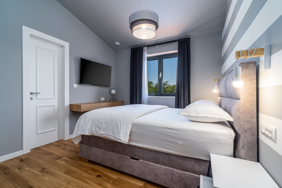 Bedroom No3 with a queen size bed 160cm x 200cm, air-conditioning, a TV, en-suite bathroom with a shower