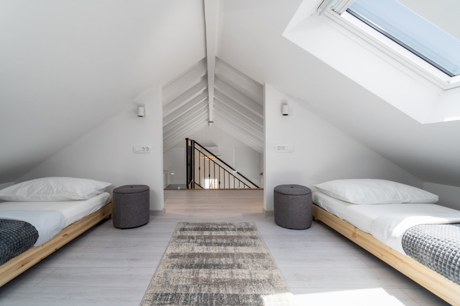 The 1st FLOOR is reached with an indoor staircase that leads you up to an opened and very cute attic Bedroom No3 (15sqm) with 2 single beds 80cm x 200cm