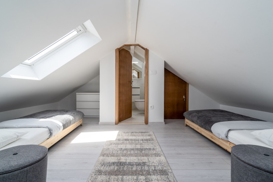 The 1st FLOOR is reached with an indoor staircase that leads you up to an opened and very cute attic Bedroom No3 (15sqm) with 2 single beds 80cm x 200cm