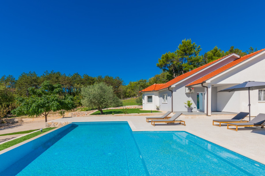 The outdoor oasis features an outdoor shower and sun deck.