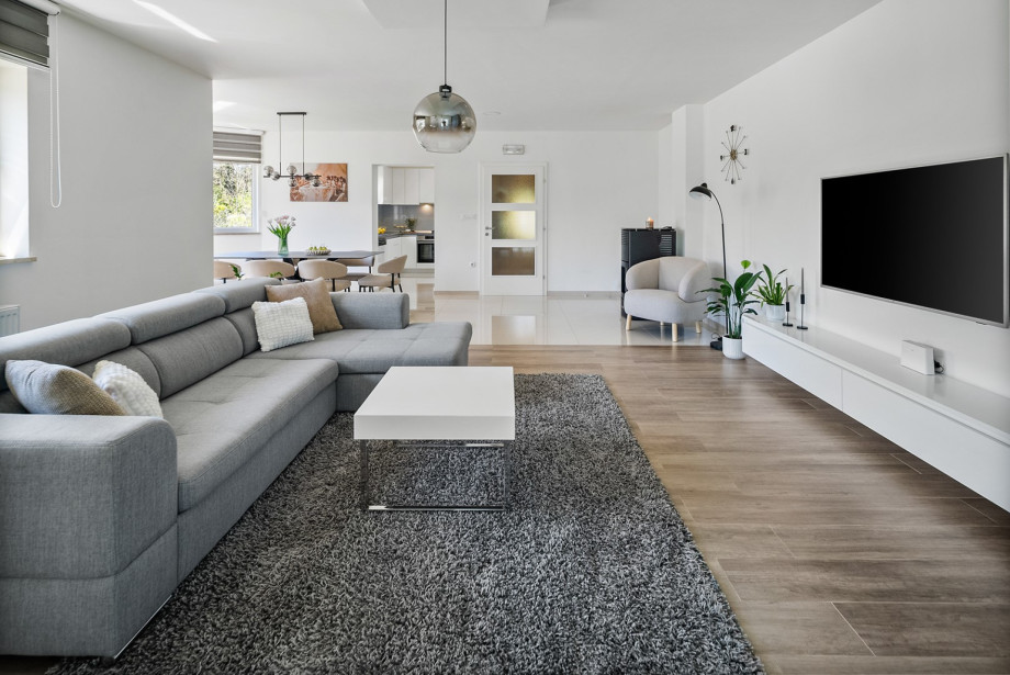 The fully air-conditioned interior features a modern living space and provides an inviting setting for relaxation.