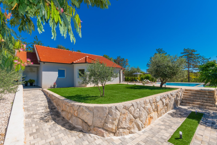 The 3000 sqm plot is nestled in a tranquil village setting.