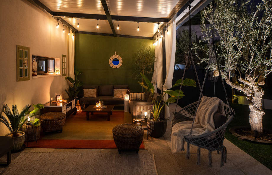 A peaceful haven under warm ambient lights offers a peaceful atmosphere on summer evenings.