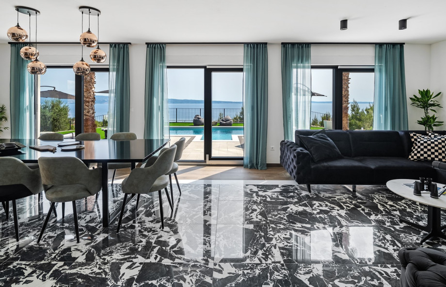 At the heart of the home is an airy, open-plan living and dining area