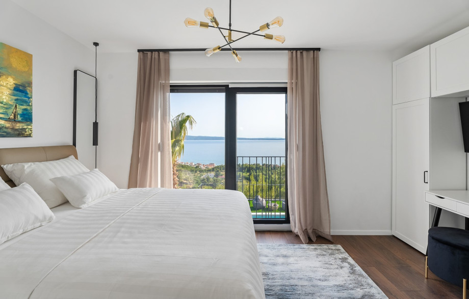 En-suite with shower, a TV and views of the sea and island.