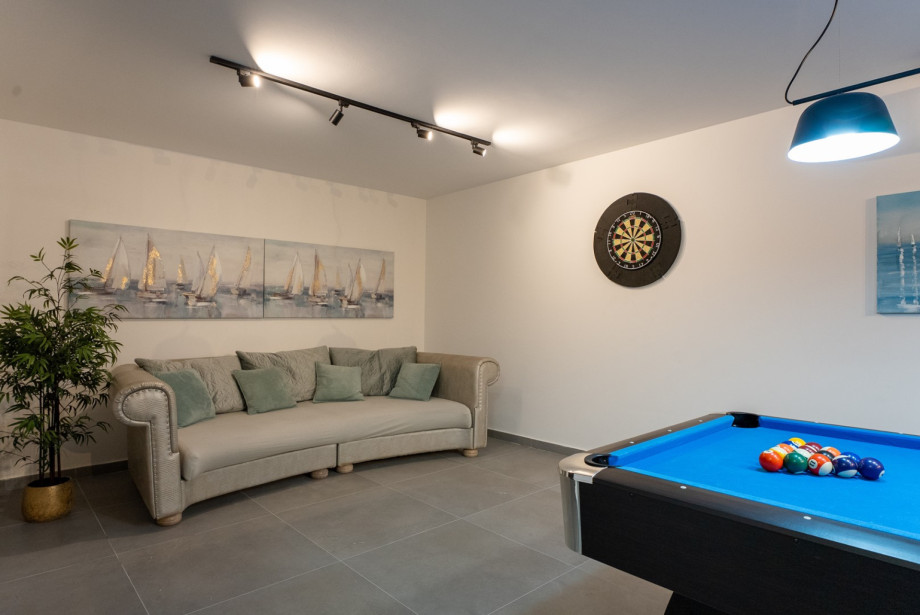 There is also a game zone with a pool table, darts and PlayStation 4.