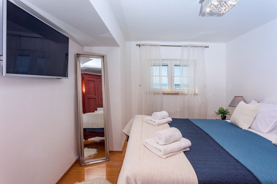 Bedroom No.2 with double bed and en-suite bathroom with shower (pool level)