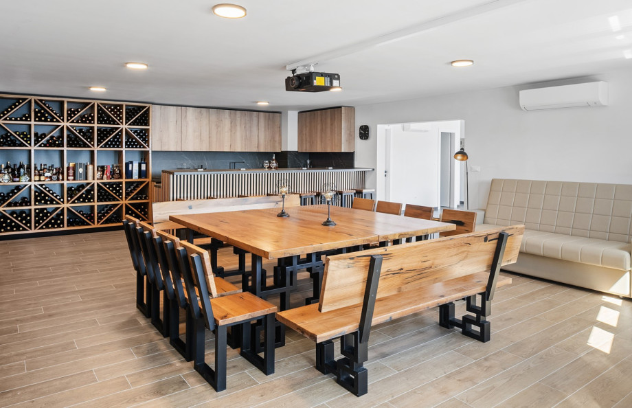 The lower ground floor houses a fun zone complete with a projector and PS5, as well as a gym featuring professional equipment.