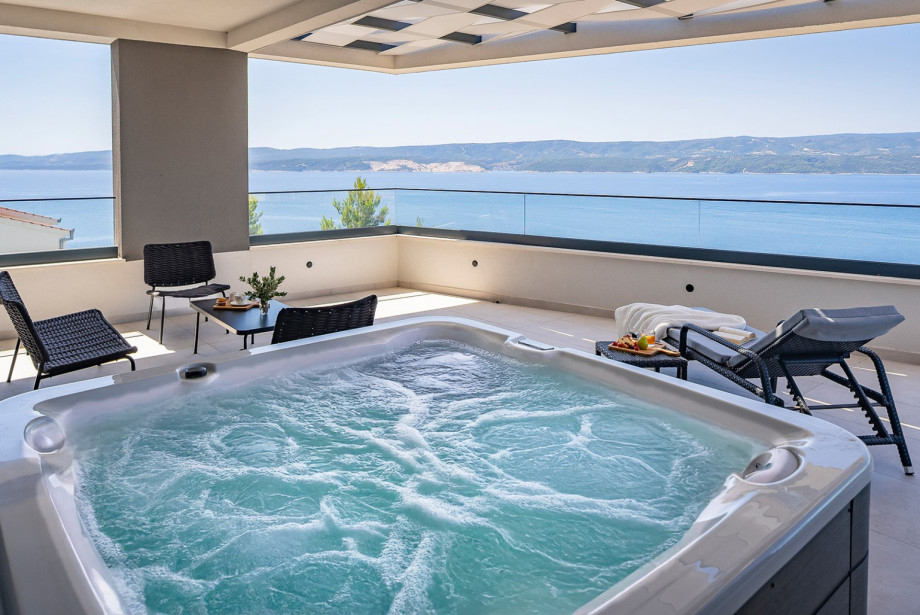 Unwind in the inviting hot tub or soak up the sun on the spacious terrace