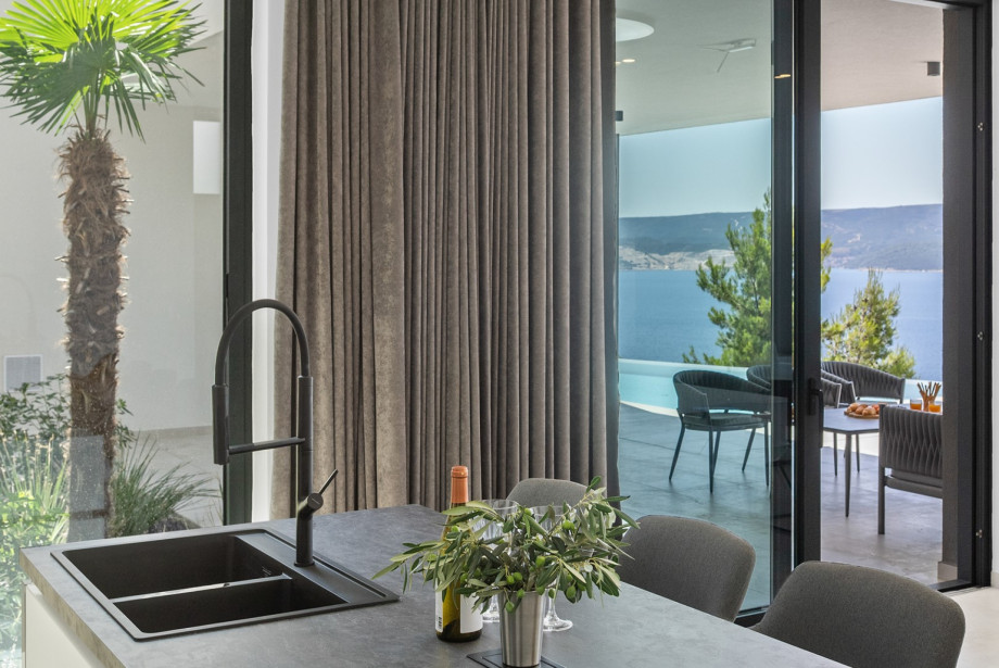 As you step inside Villa Angelus, you'll be captivated by its elegant design and high-end furnishings