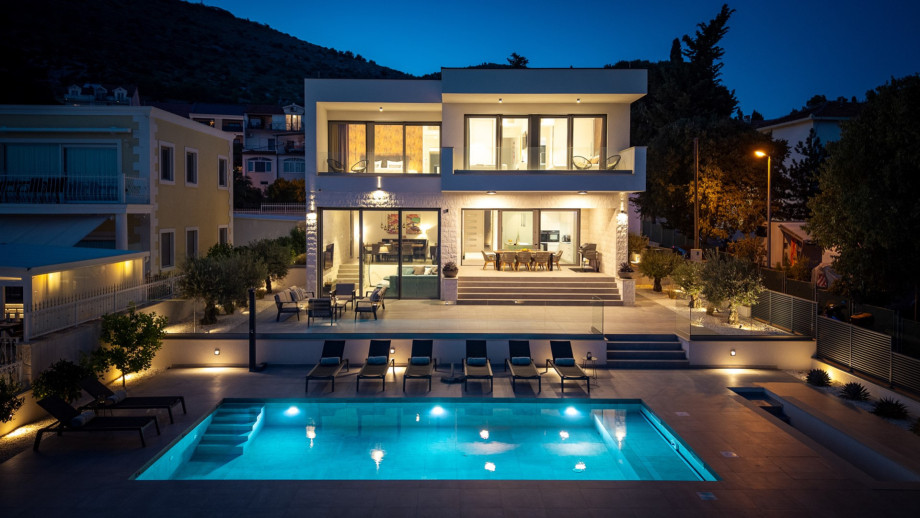 An enchanting, peaceful oasis on the beach by night.