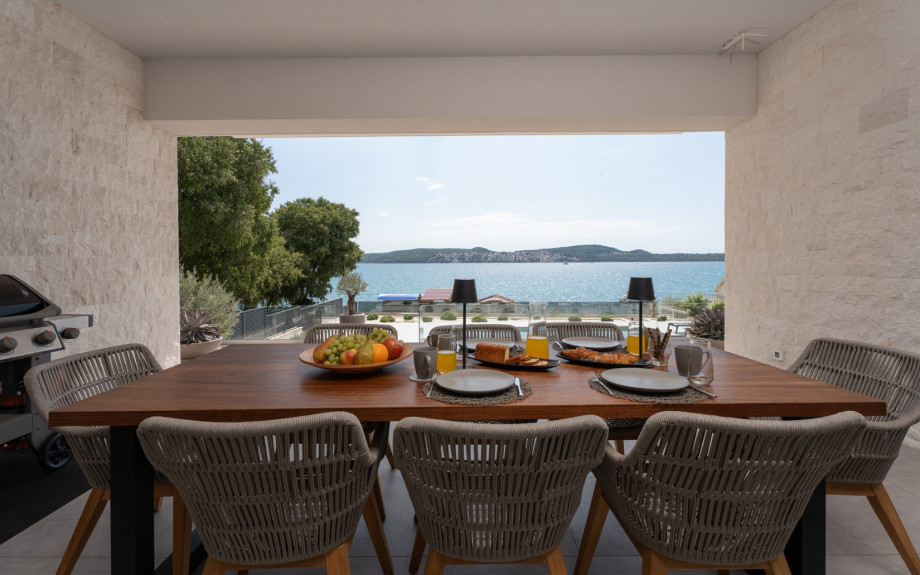 The outdoor lounge — for long, slow breakfasts by the sea