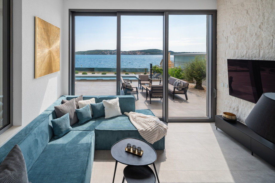 Living room with a modern TV and PlayStation 5.