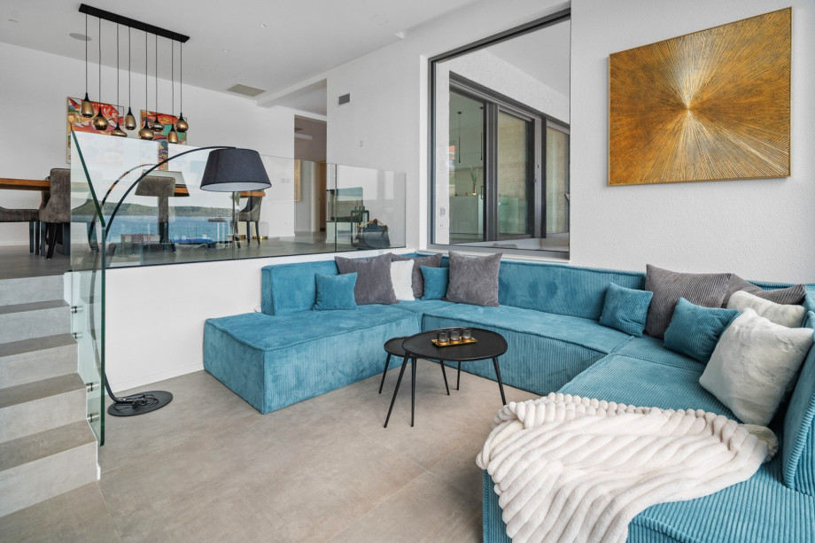 A spacious living room with plush sofas.