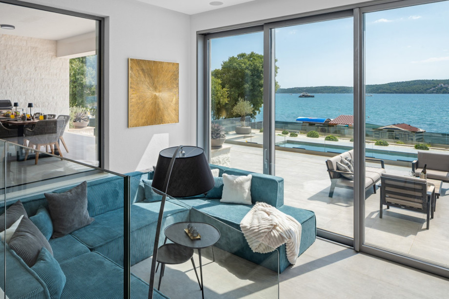 A spacious living room with a Sonos sound system.