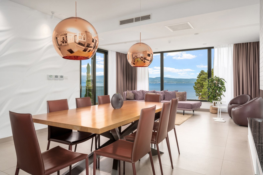 Fully equipped kitchen with exit to outdoor dining area and playground