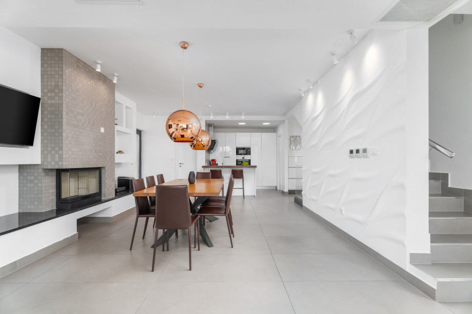 Fully equipped kitchen with exit to outdoor dining area and playground