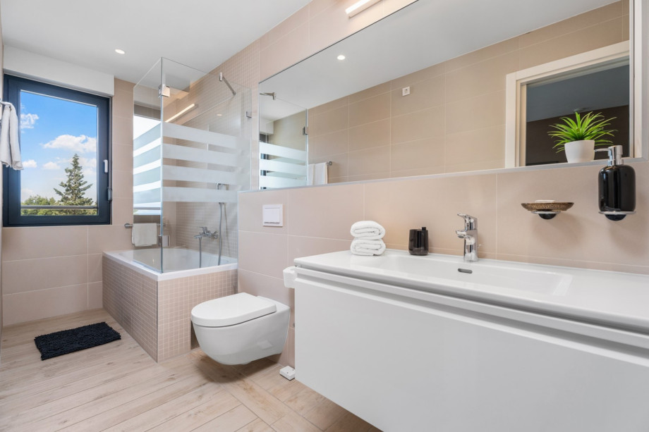 One of 4 en-suite bathrooms with bathtub, shower, bidet and sea views