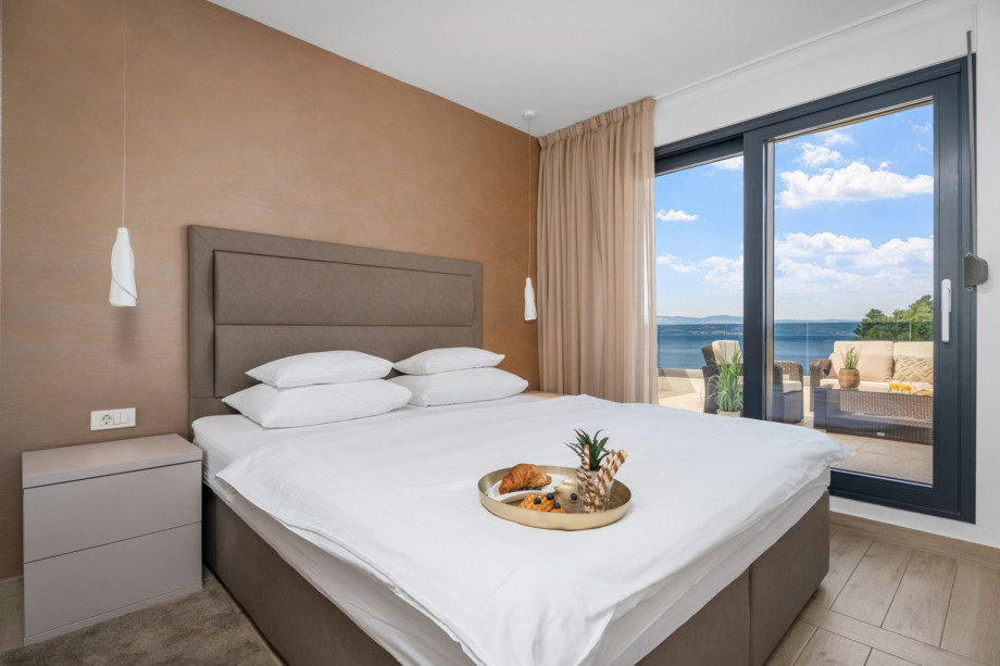 One of 4 bedrooms with double bed 180x210cm, en-suite bathroom, TV and sofa bed