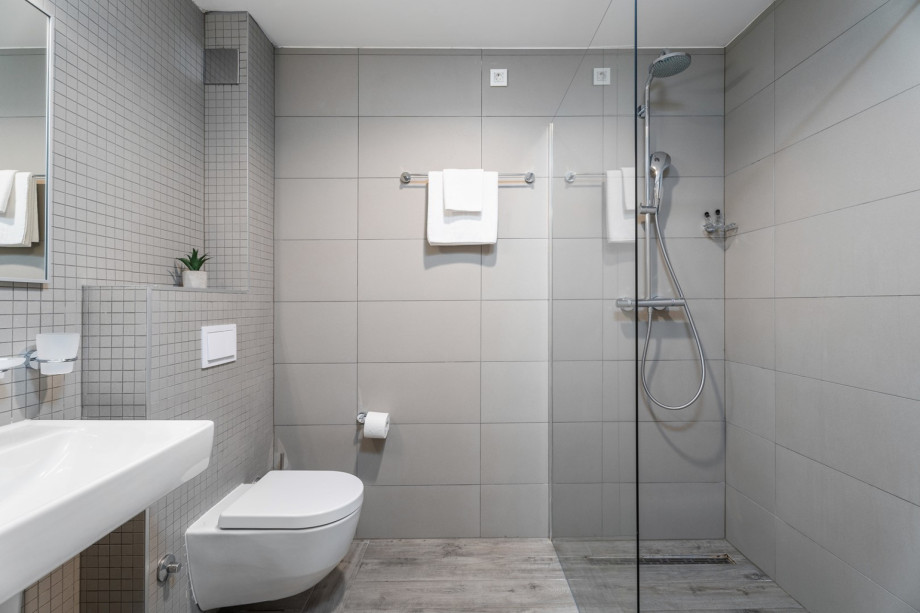 Bathroom with shower at gym and sauna level
