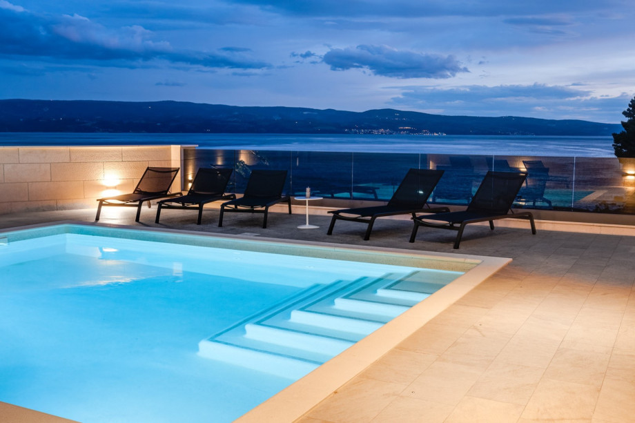 Pool area with carefully set lights for cozy evenings in quiet area