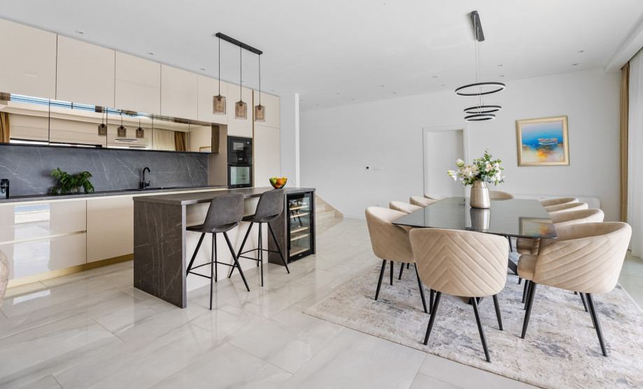 The fully equipped kitchen features a luxurious kitchen island, making meal preparation an enjoyable experience