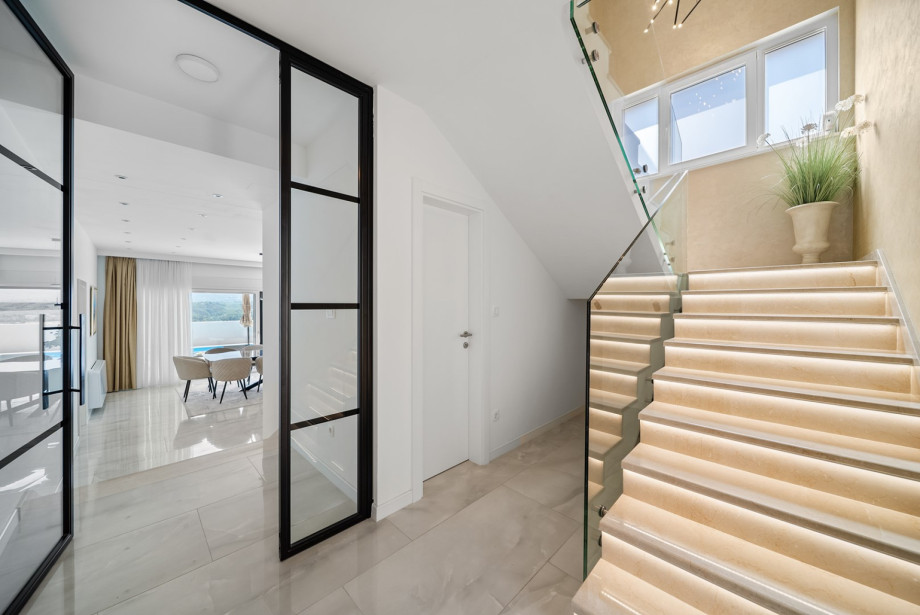 Spacious staircases and very nicely decorated hallways leading to the bedrooms