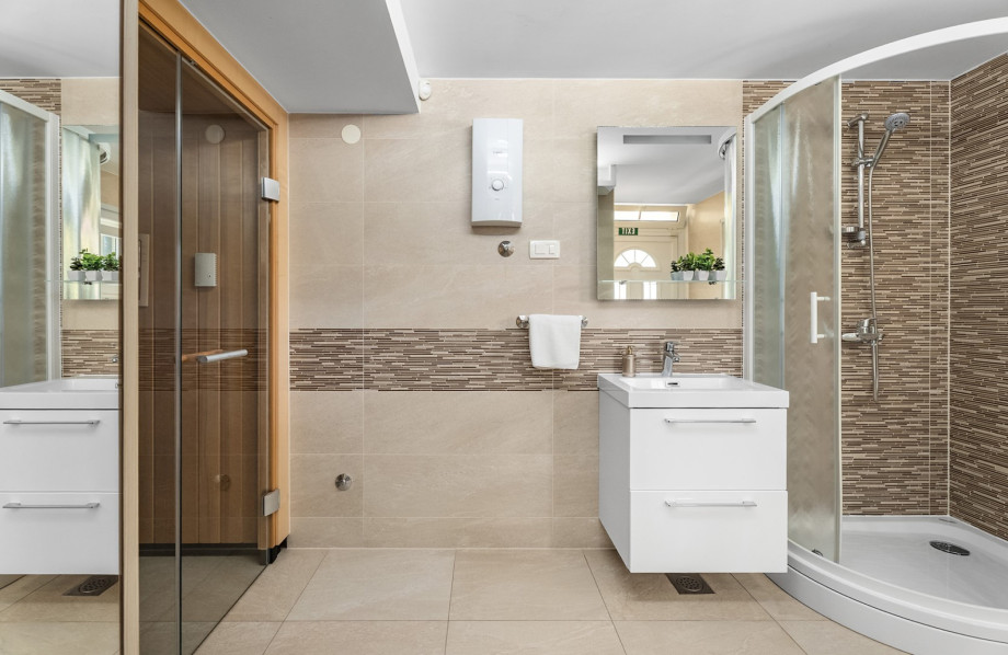 A functional space featuring a shower as part of the villa's spa-like comfort.