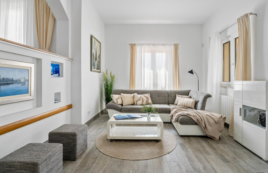 Relax in the living area equipped with comfortable sofas and air conditioning.