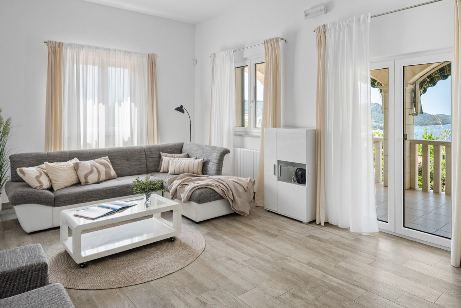 Enjoy sea views from the covered terrace accessible directly from the living room.