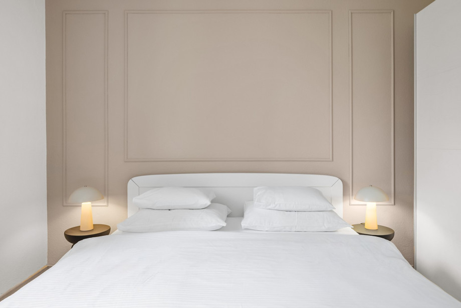 This bedroom offers a comfortable king-size bed and air conditioning.