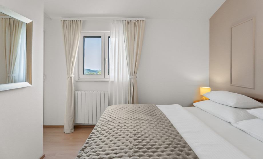 This space offers a 160cm x 200cm bed for a peaceful, air-conditioned stay.