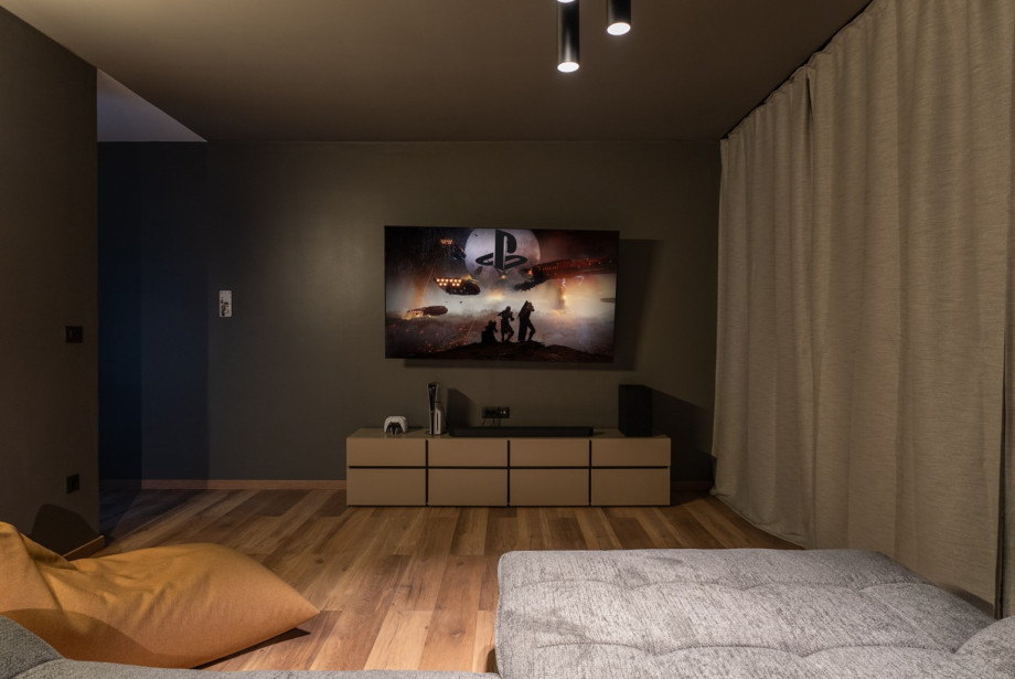 A modern lounge area with a cozy seating, ideal for relaxing and entertainment