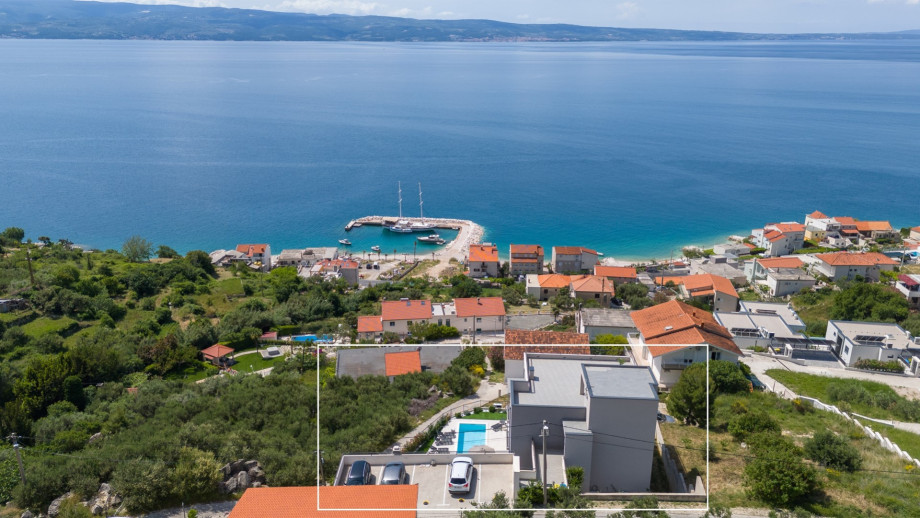 This residence boasts six spacious bedrooms, media room and gym