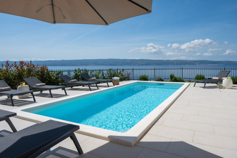 Sundeck area with private heated pool