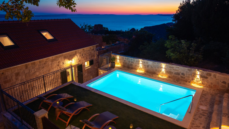 The 20 sqm pool is nestled among vibrant Mediterranean vegetation and oak trees.