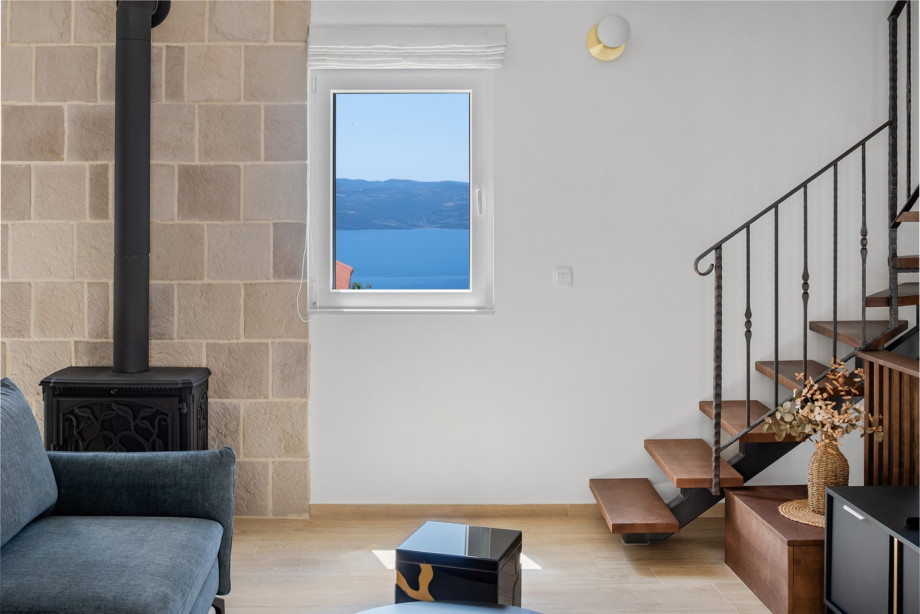 Relax on the comfortable sofa in a beautifully appointed space.
