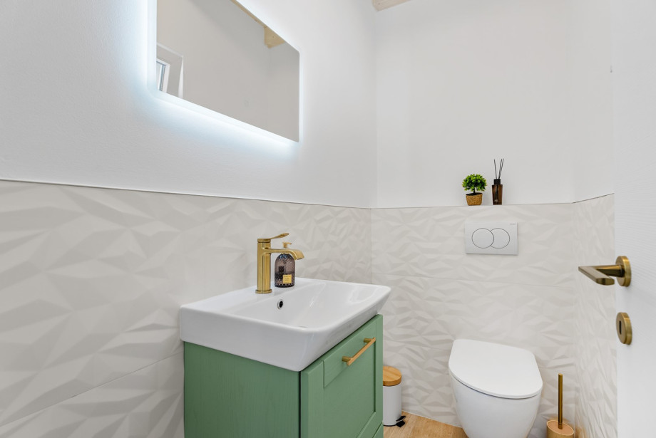The ground floor features a beautifully appointed and convenient separate toilet near the living area.
